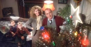 A Christmas Story family putting up the Christmas tree star.